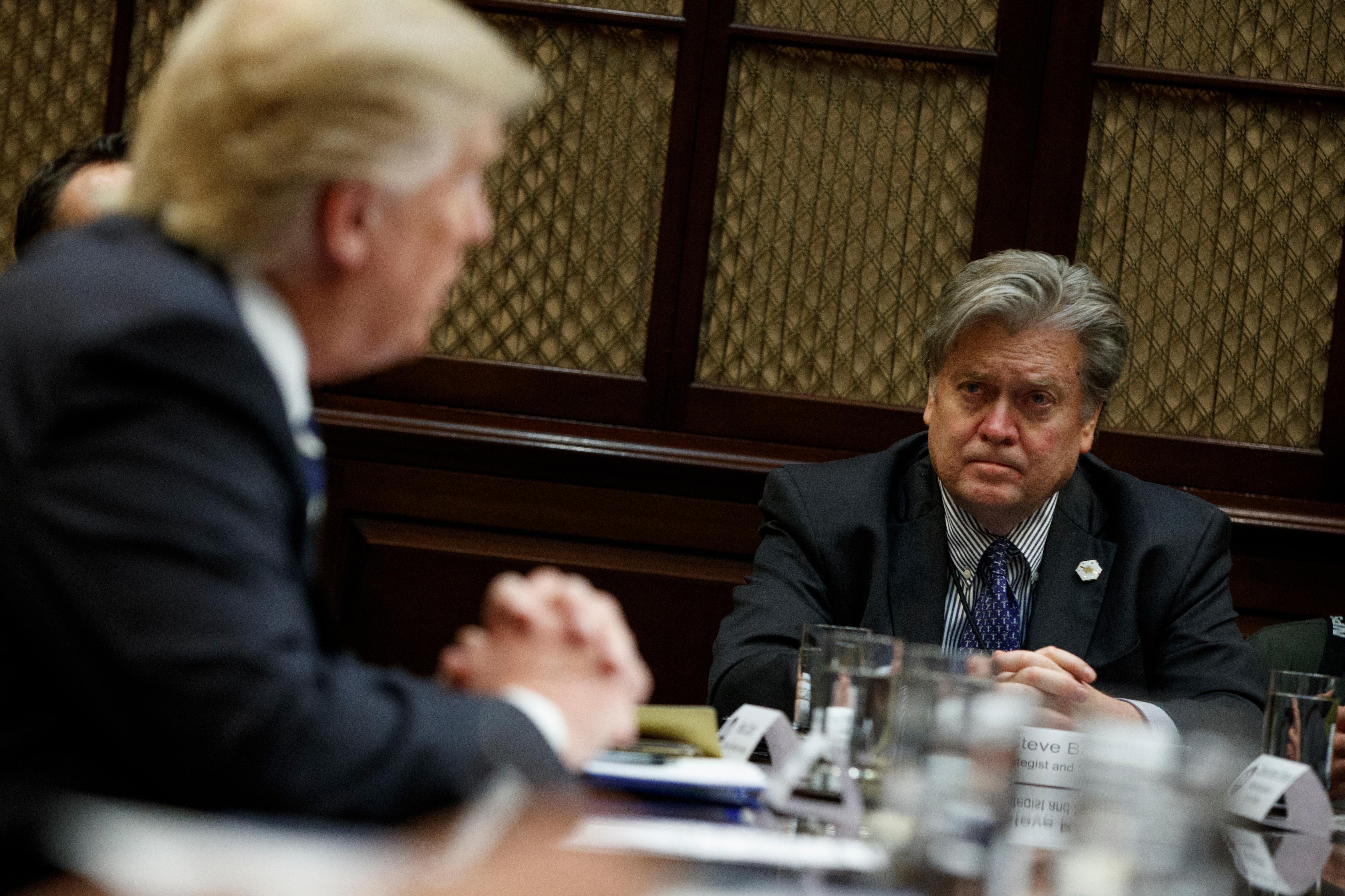 house chief strategist steve bannon listens as president donald