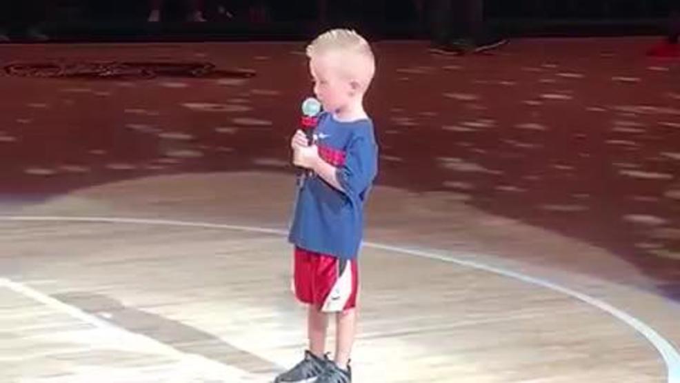 Little boy sings The National Anthem in front of basketball fans (Courtesy Curt Schuman)