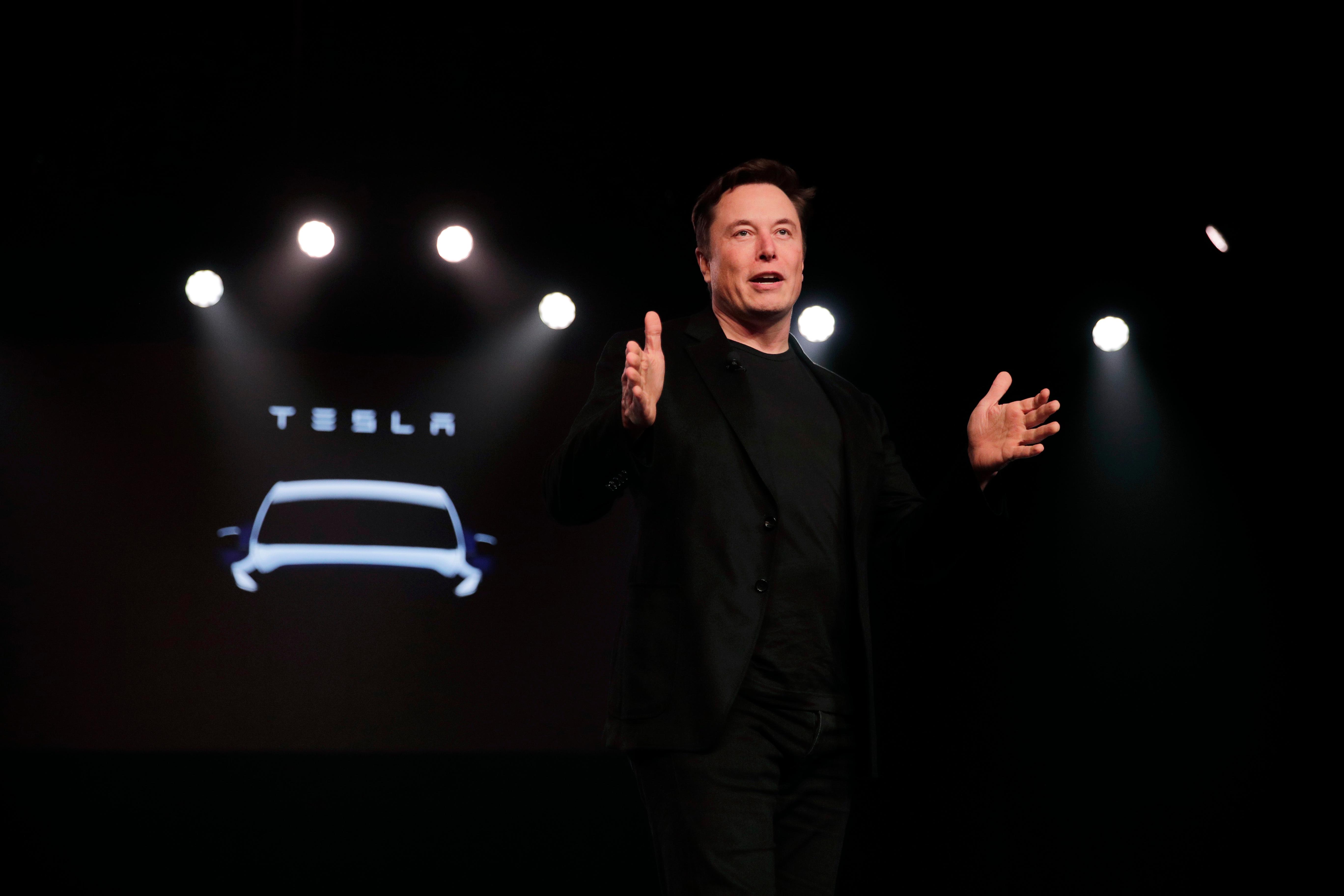tesla ceo elon musk speaks before unveiling the model y at tesla